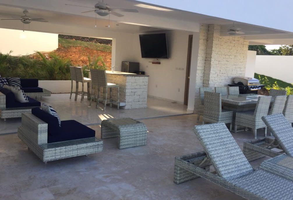 buyDRproperty Outdoor living space of Beautiful Villa SEASHELL in Casa Linda with seating, bar, and dining area. Sosua Real Estate