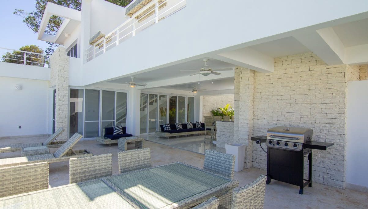 buyDRproperty Beautiful Villa SEASHELL outdoor patio in Casa Linda with grill and seating. Sosua Real Estate
