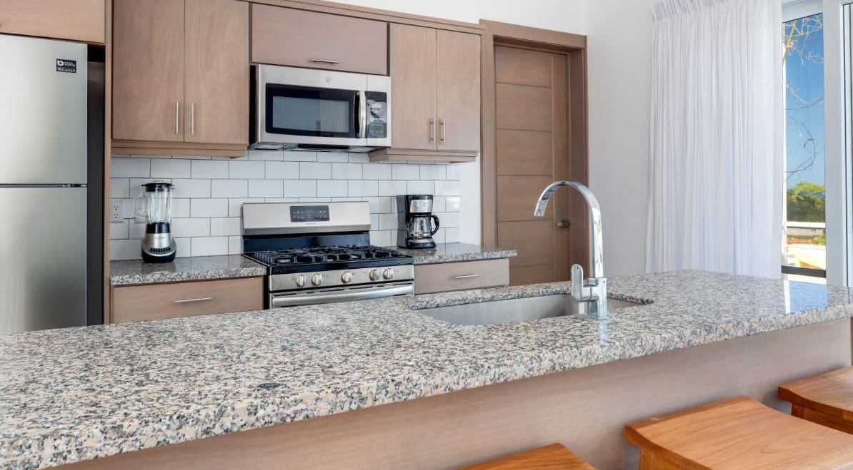 buyDRproperty Modern kitchen with granite countertops in a Beautiful Villa SEASHELL in Casa Linda Sosua Real Estate
