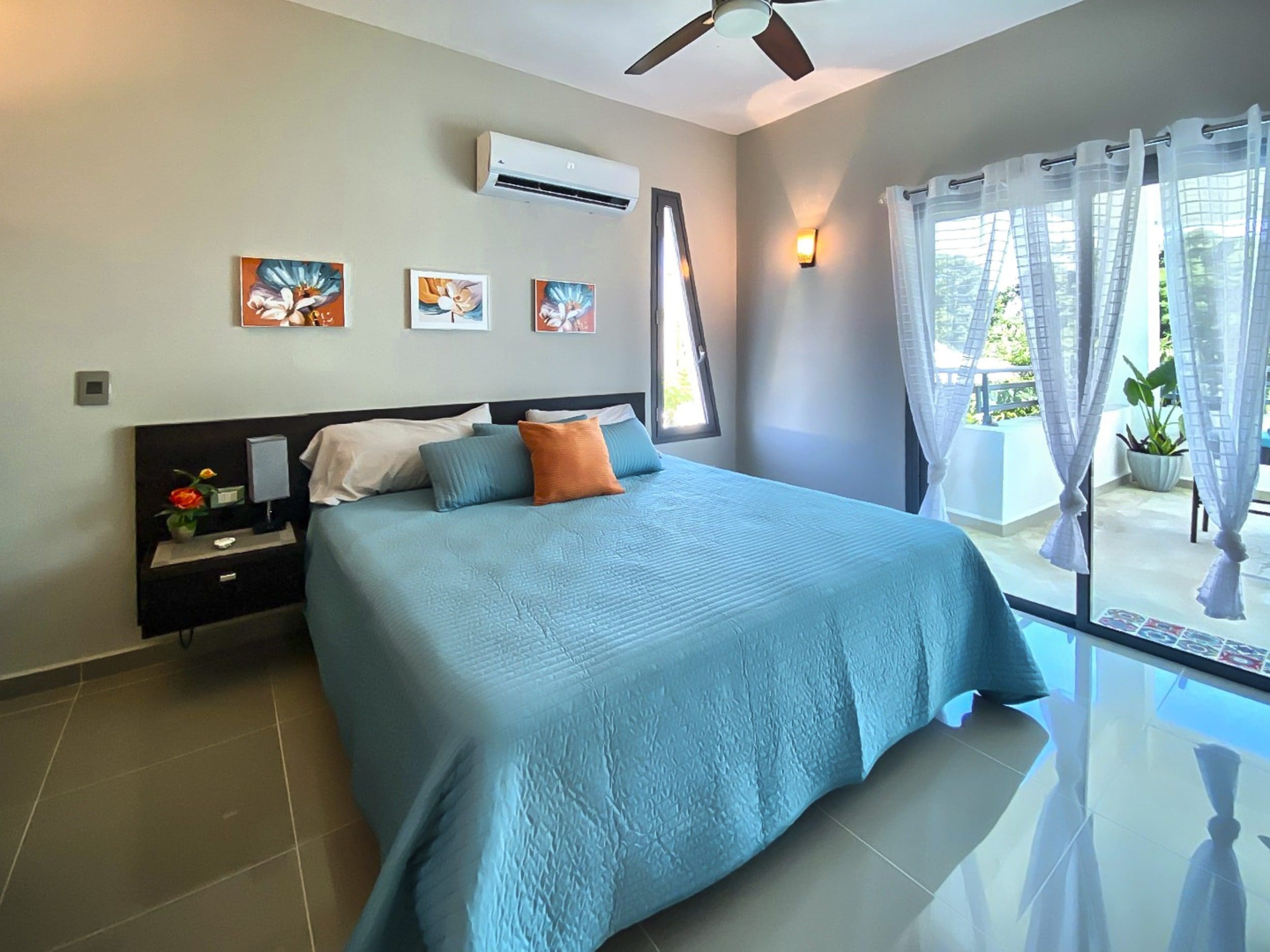 buyDRproperty Modern bedroom in a ProCab penthouse with balcony access. Sosua Real Estate