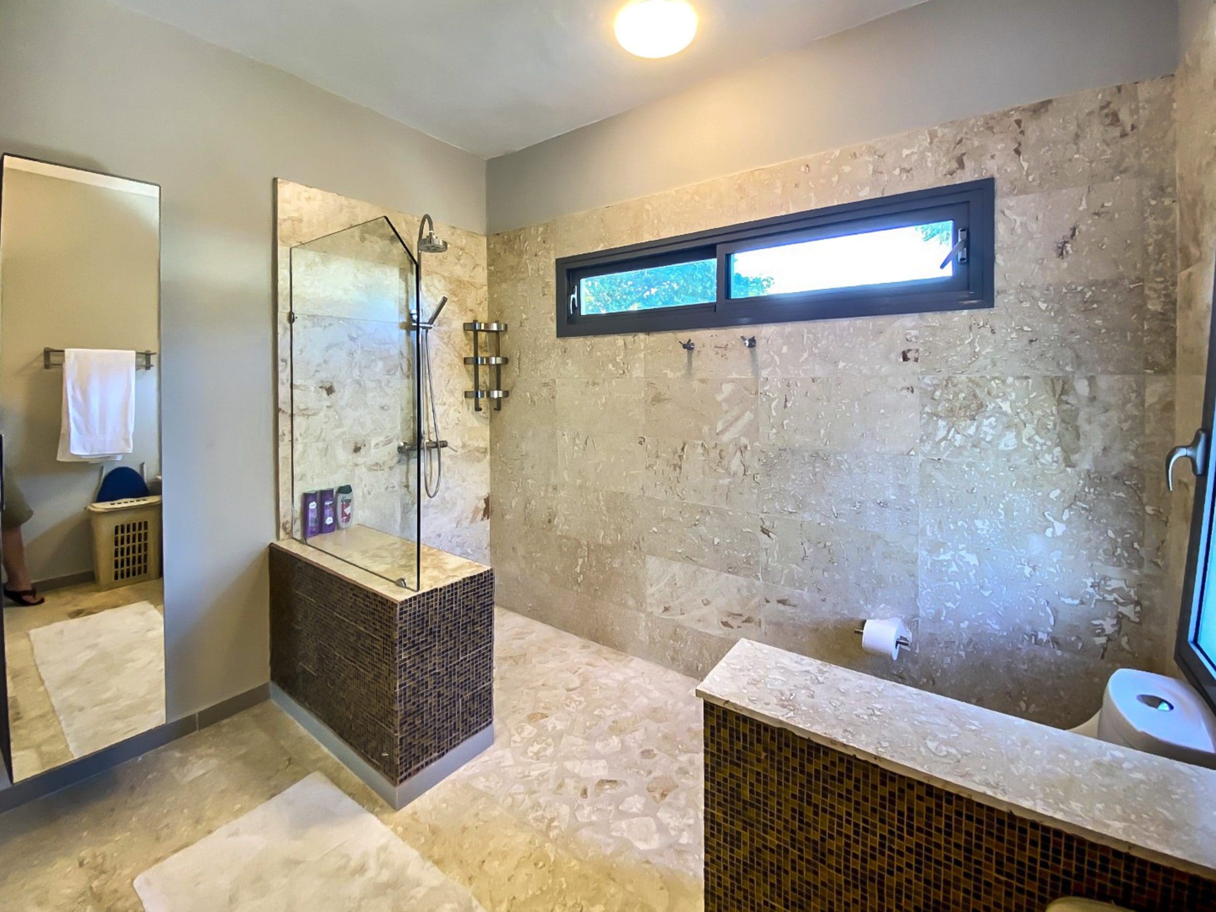 buyDRproperty Luxurious bathroom with walk-in shower and stone tile. Sosua Real Estate