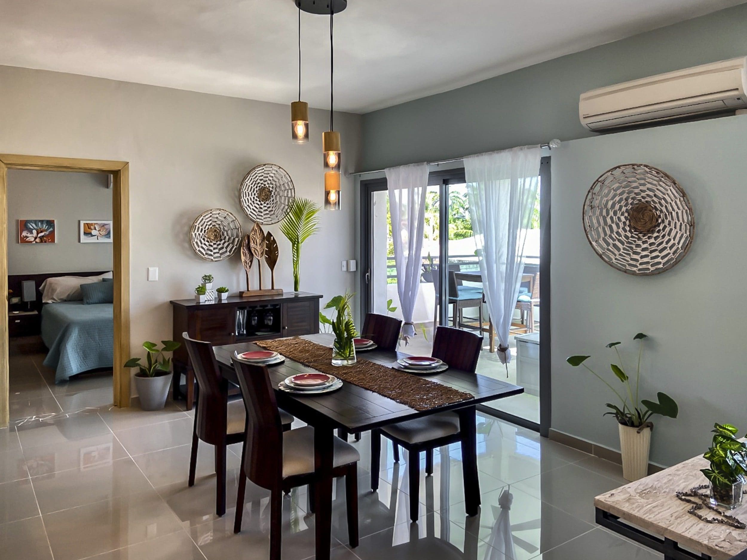 buyDRproperty Stylish dining room, perfect for entertaining in a 2-bedroom penthouse. Sosua Real Estate