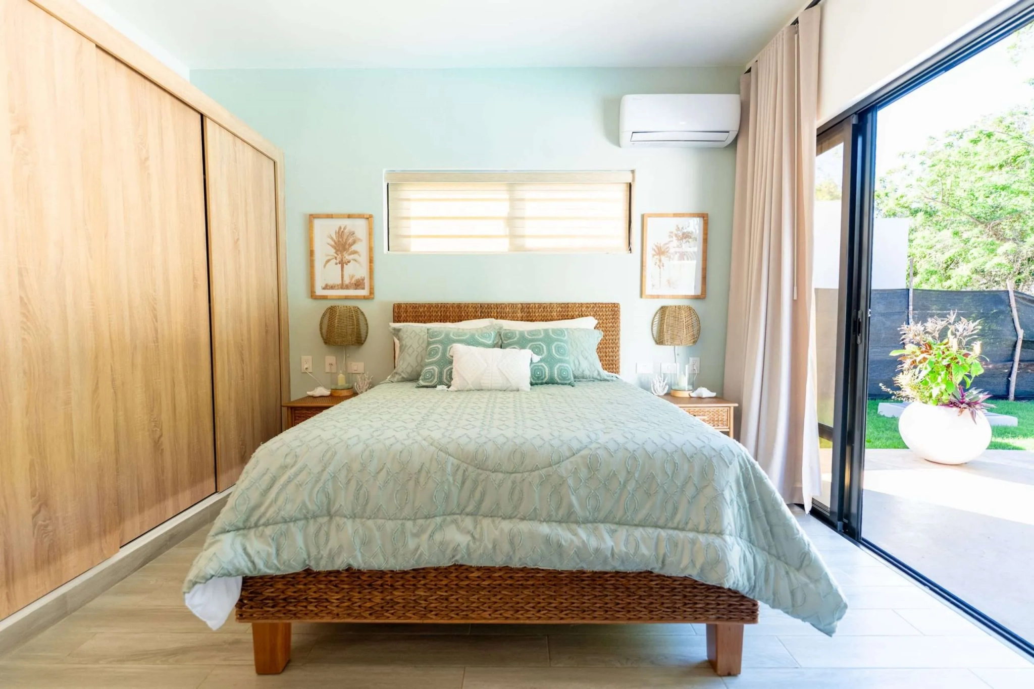 buyDRproperty Serene bedroom with king-size bed, ocean-themed decor, and ocean view. Sosua Real Estate