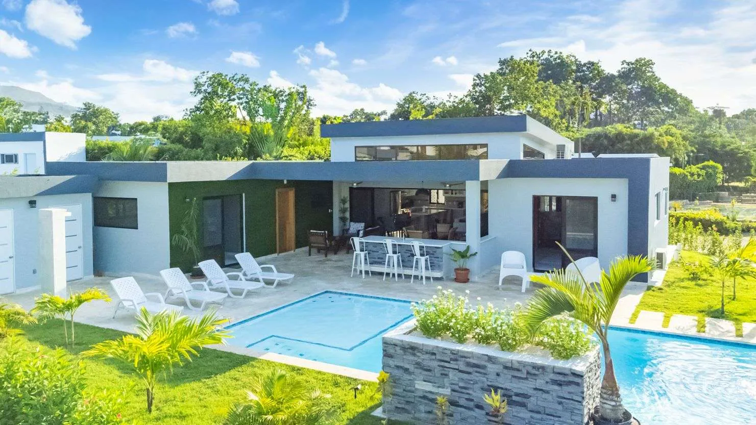 buyDRproperty Modern luxury villa with pool and outdoor bar in a tropical setting Sosua Real Estate