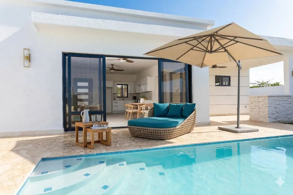 buyDRproperty Luxury villa with pool, outdoor lounge, and modern patio furniture Sosua Real Estate
