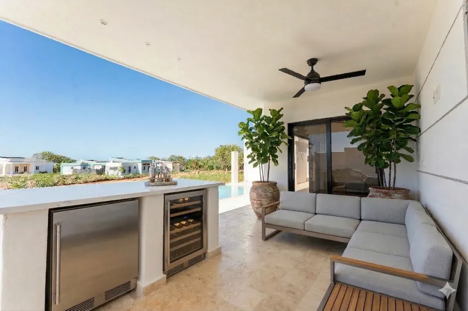 buyDRproperty Modern outdoor patio with a sectional sofa, wine fridge, and mini-fridge Sosua Real Estate