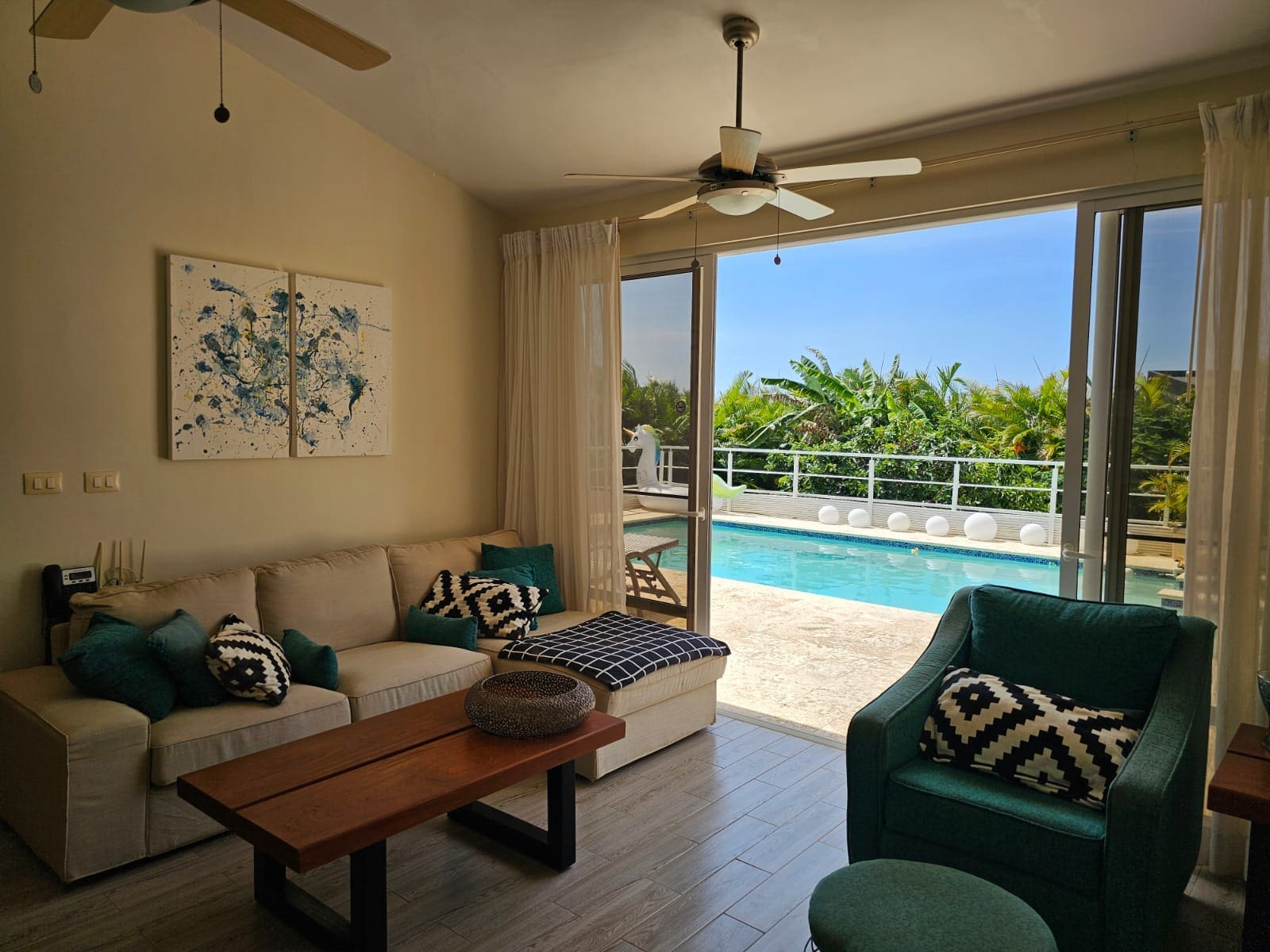 Casa Linda Sosua villa living room opening to private pool and tropical garden